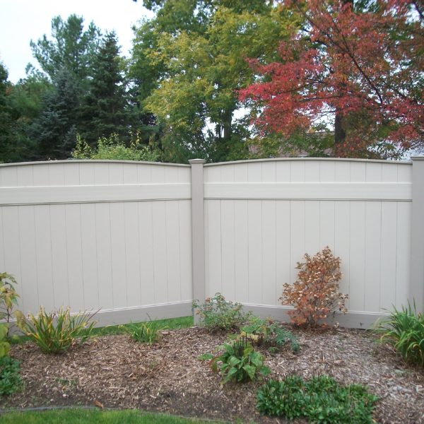 Tan vinyl privacy fencing