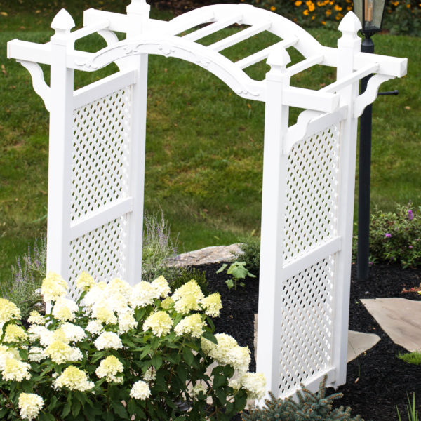 White vinyl backyard arbor