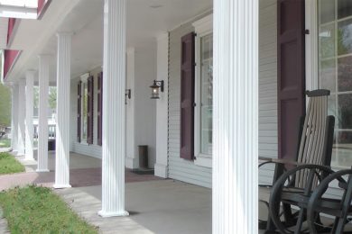 white structural columns on front porch