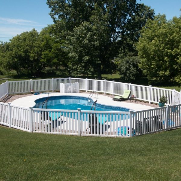 White vinyl fence around pool