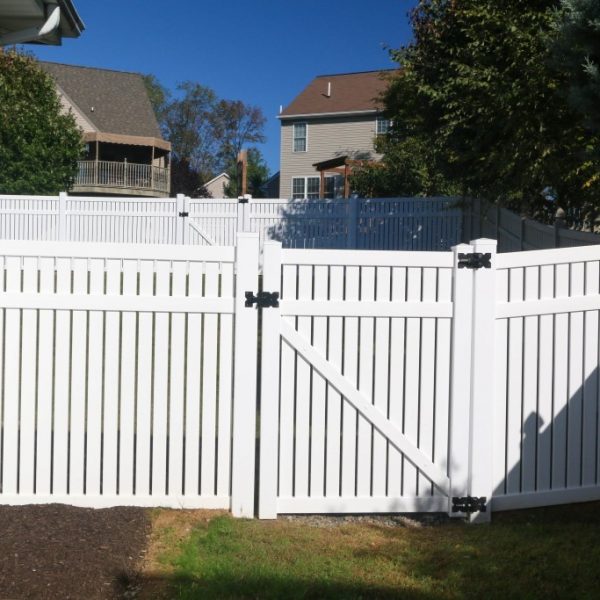 White vinyl fencing with a gate