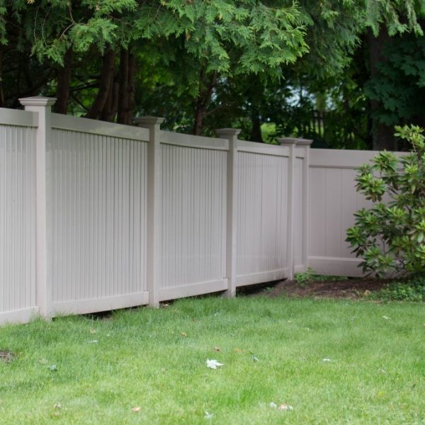 Tan vinyl privacy fencing