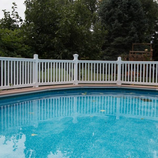 Pool deck with white vinyl guard rails