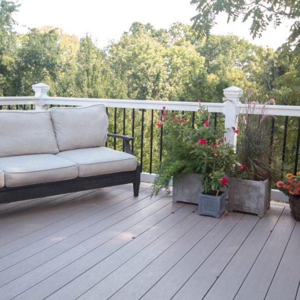 White frame and black spoke vinyl deck railing