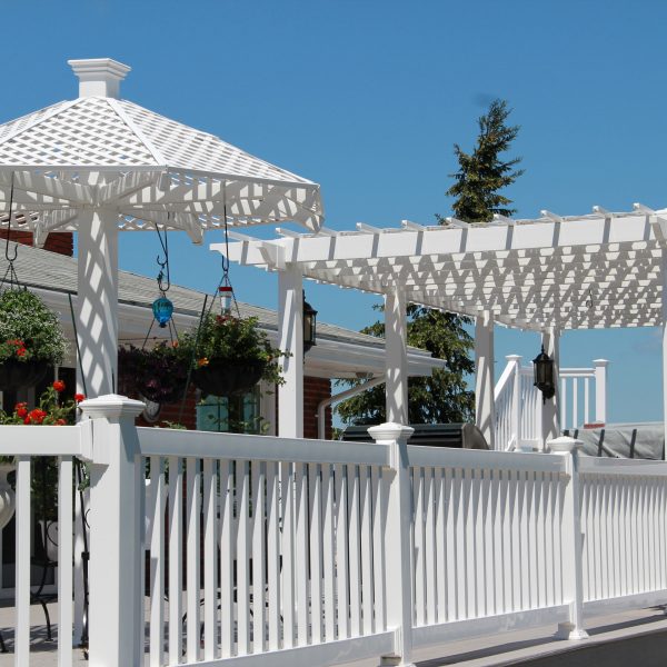 White vinyl deck rails with white vinyl pergola