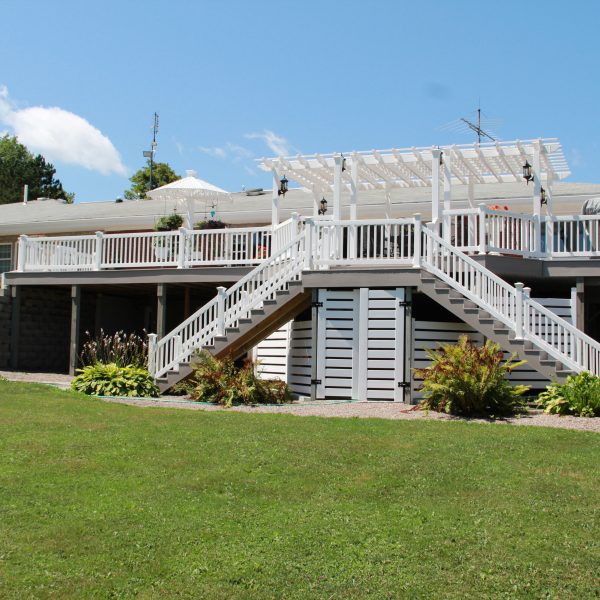 Large composite decking with white vinyl guide rails