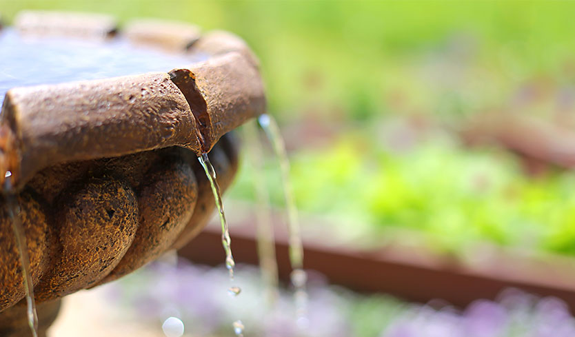 patio fountain creating privacy in backyard by eliminating access noise