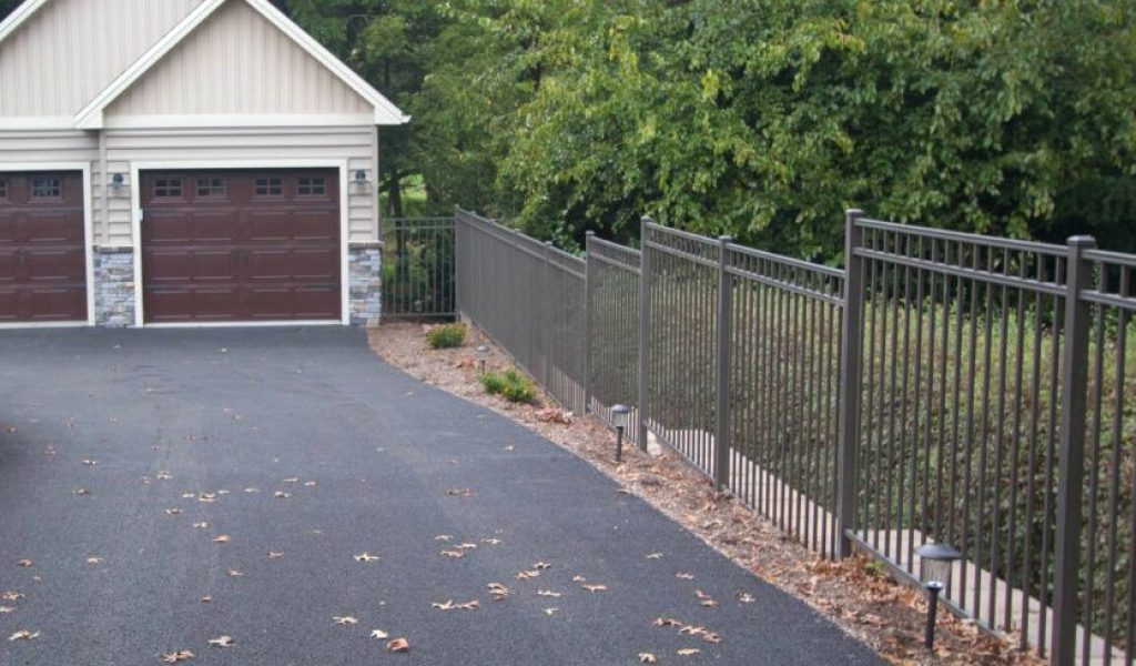 tall aluminum picket fence by driveway